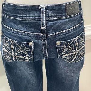 Zco jeans with cross on pockets